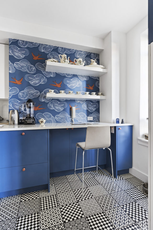 Blue and white kitchen with fun wallpaper